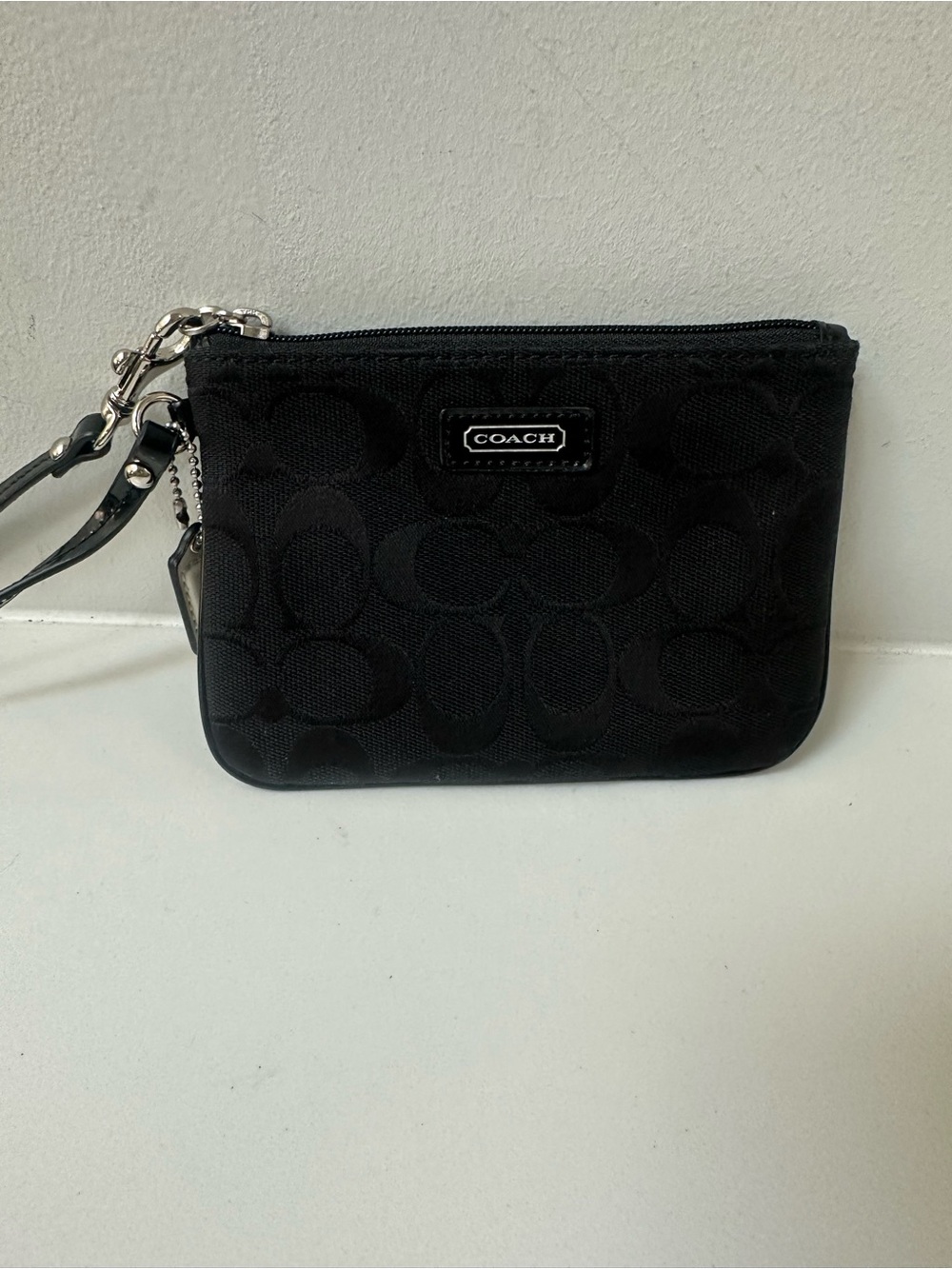 COACH Black Signature Wristlet with white coach tag